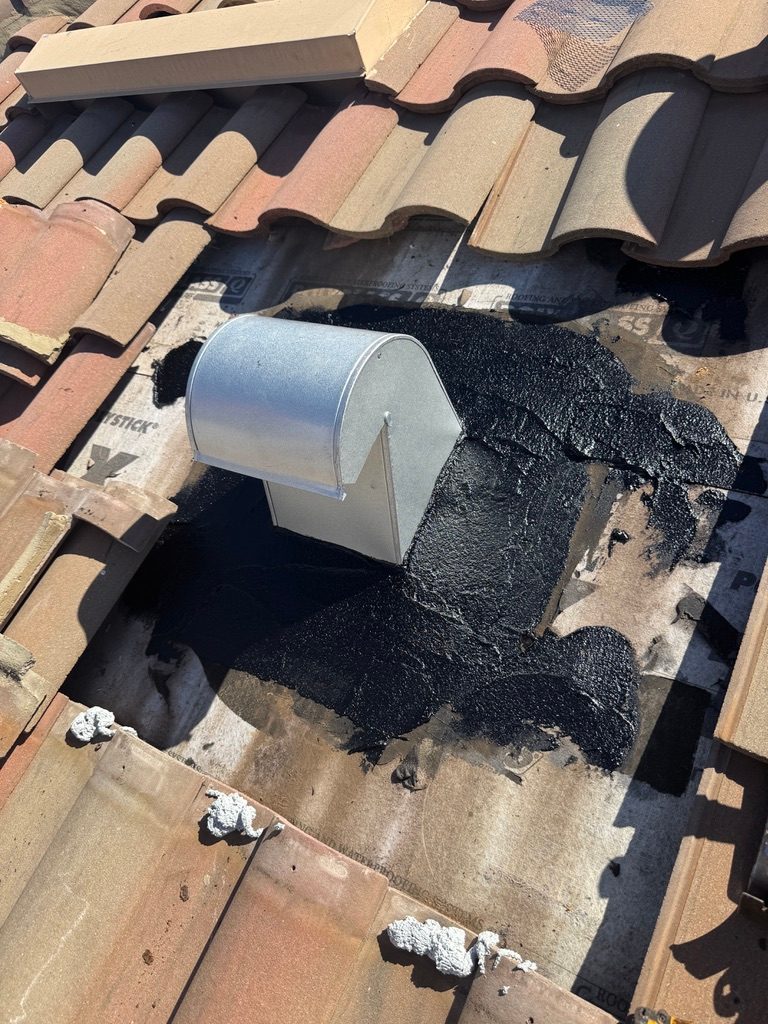 New 10 inch gooseneck roof vent sealed into the underlayment on a tile roof in Naples FL