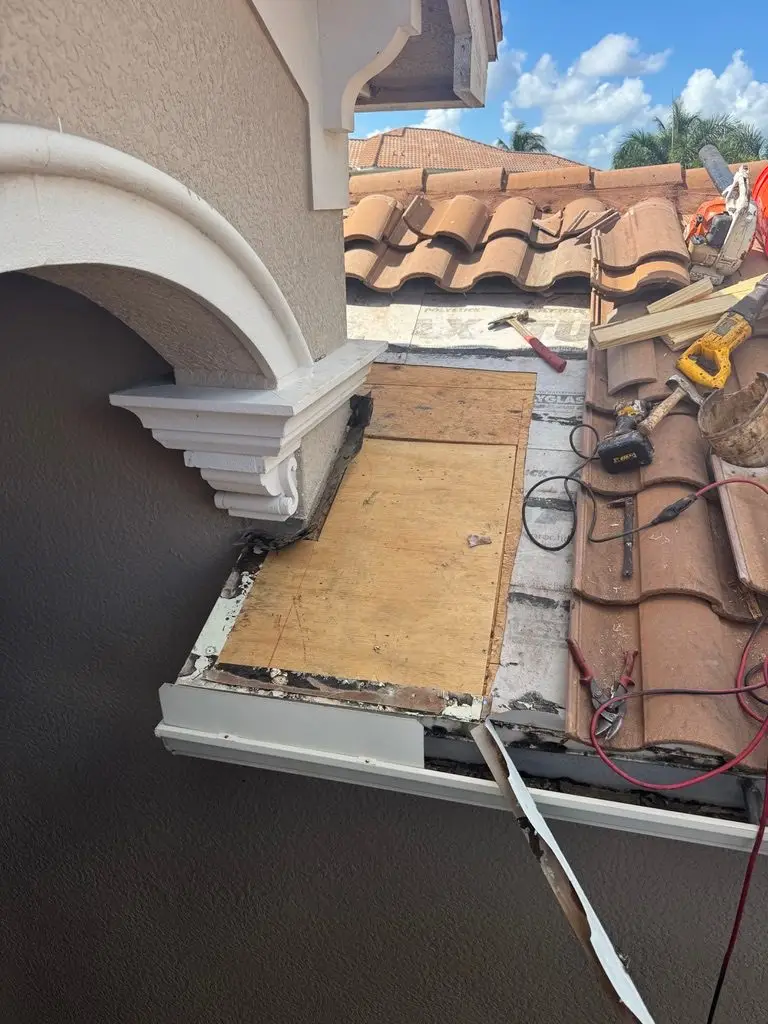 Damaged sheathing cut out and replaced with new plywood on a tile roof in Riverstone, Naples